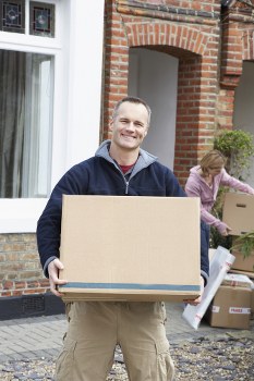 Man With A Van Newcross moving furniture on a local street