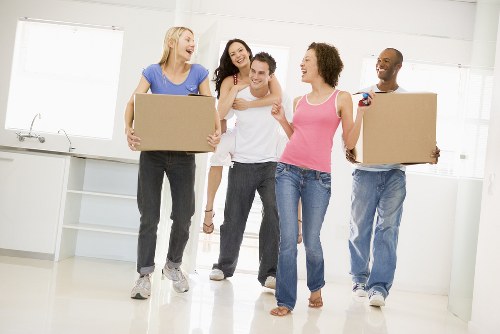 Movers handling a residential move in New Cross on a local street