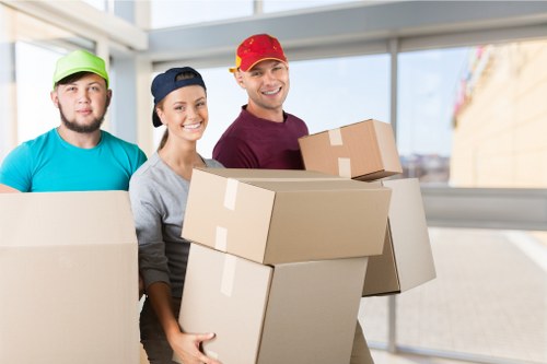 Packed moving boxes and furniture ready for a home removal in New Cross