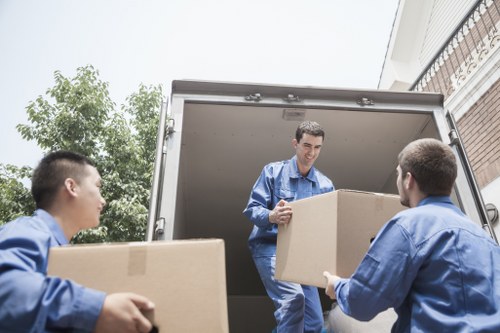 Checklist and packed household items prepared for a New Cross home move