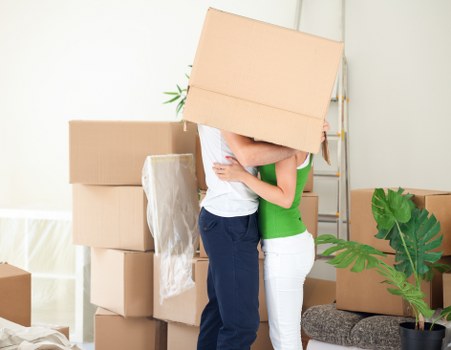Furniture and boxes being loaded into a moving truck