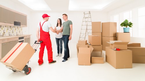Removal team loading furniture for a flat move in New Cross
