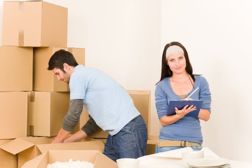 Packed boxes and furniture ready for a local home move in New Cross