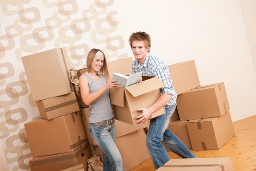 Moving boxes and office furniture ready for transport in New Cross